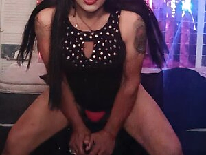 Crossdresser fucking a dildo
