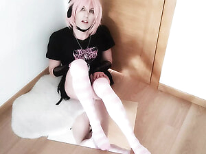 Leona Incubo is dressed with black shirt and skirt, with pink socks and lingerie, also with pink hair. She touches her girlcock while undressing and using toys for her pleasure. First anal beads, a dildo, then a bigger dildo and finally anal beads plus a 