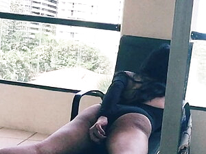 asian tranny stroking her big cock in her hotel balcony