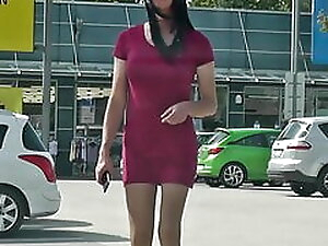 Crossdresser Sissy wears red mini dress in public